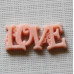 Пластиковое украшение "Love" кораллового цвета, 23х10 мм